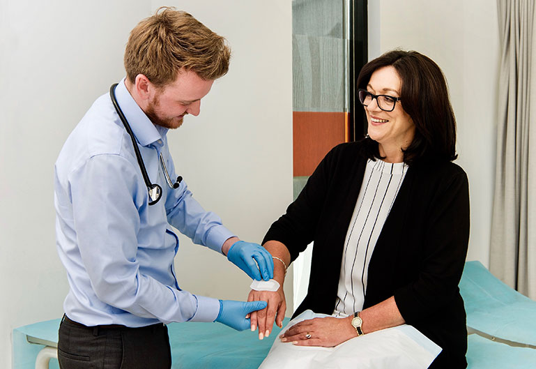 Doctor with stethoscope performing examination